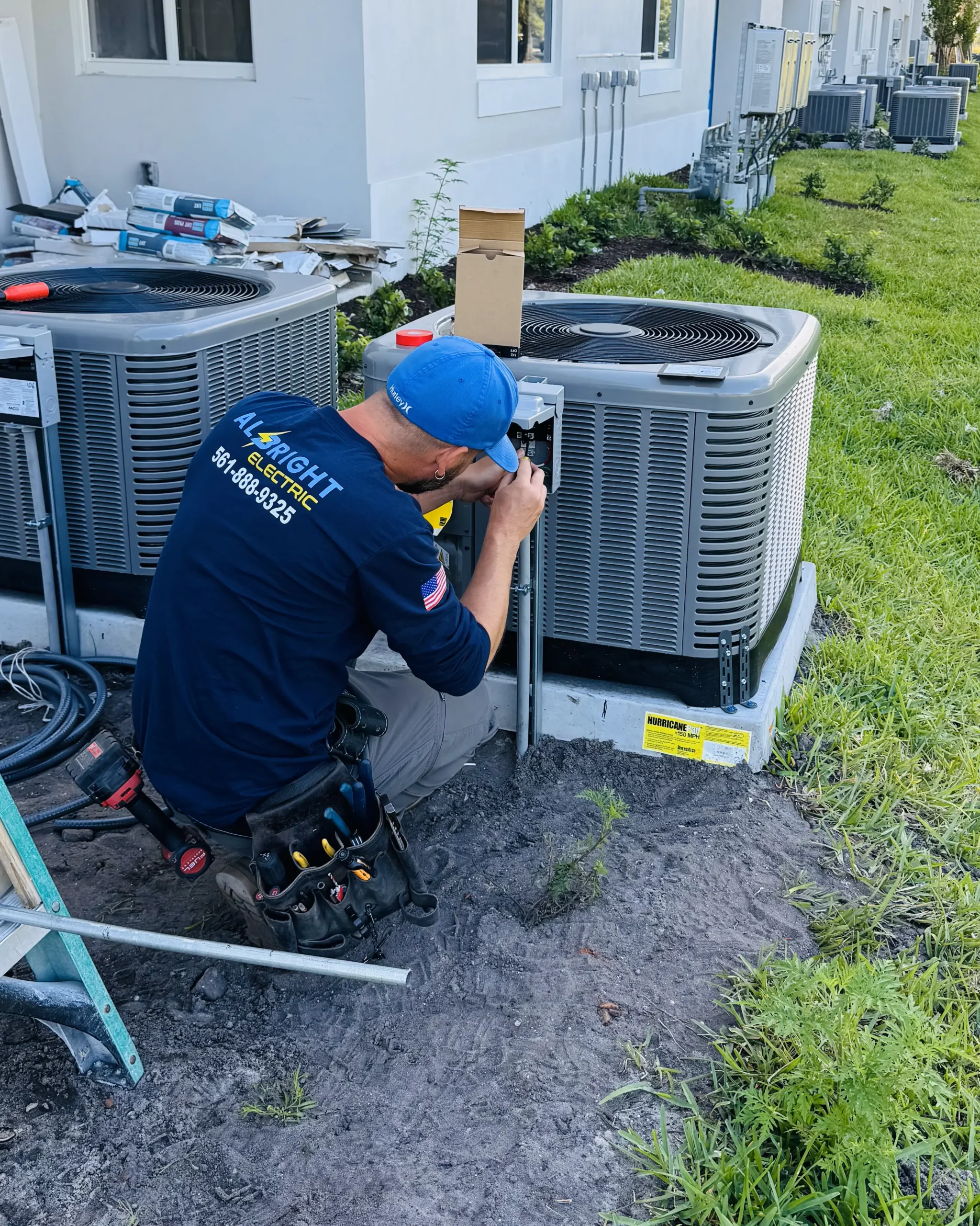 A technician beside outdoor equipment
