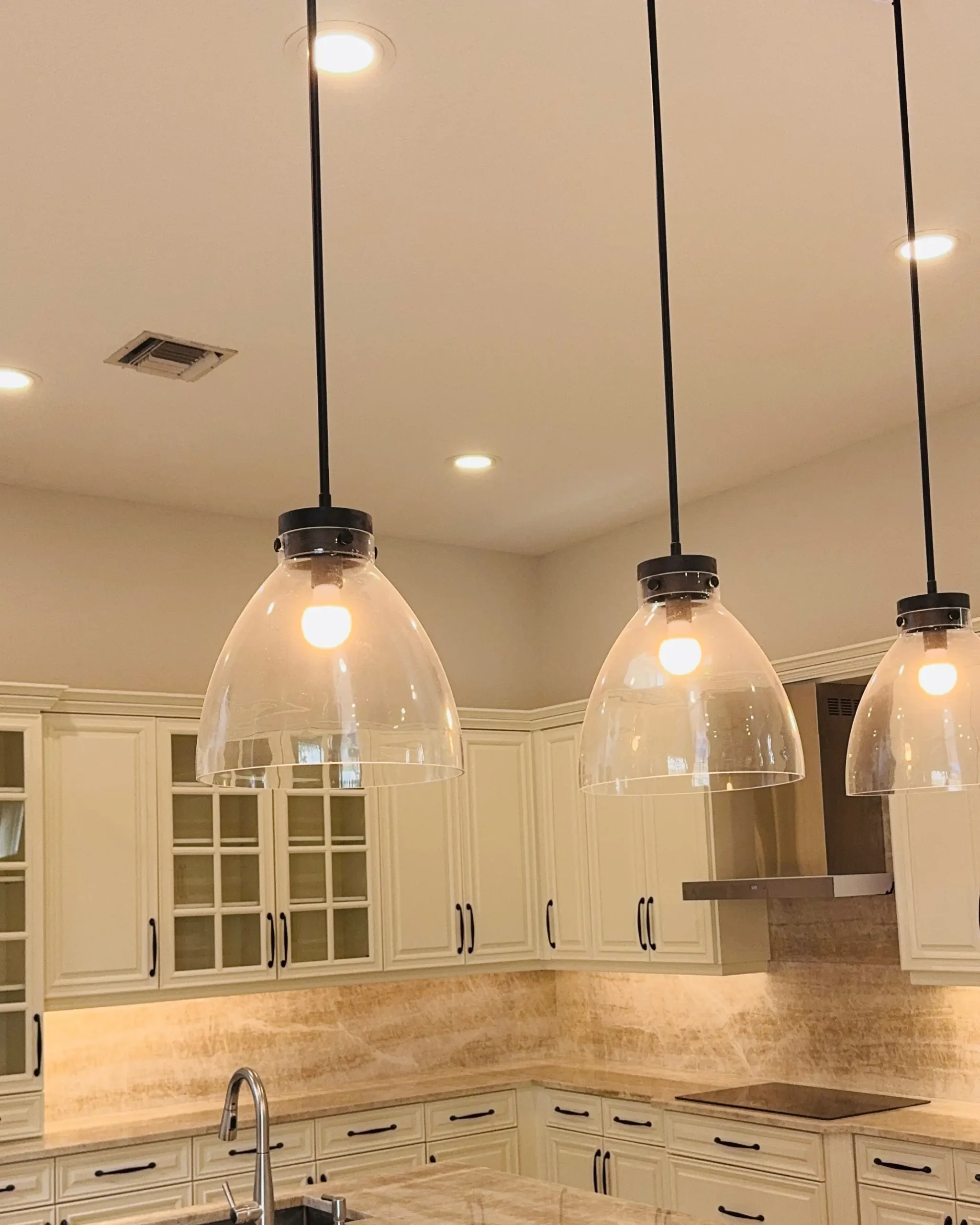 Pendant lights over a kitchen island